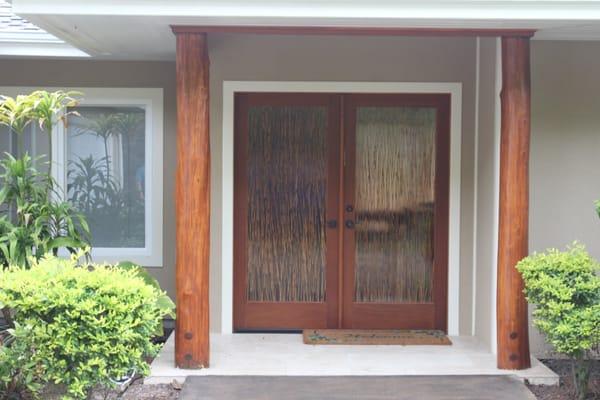 Front entrance of custom home with Ohio or native wood posts. Built by Big Island contractor General Construction