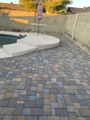 Pavers behind pool