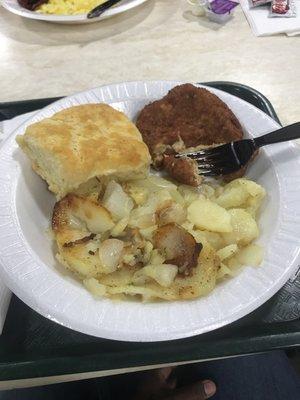 Salmon cake and scratch made scalloped potatoes and scratch made biscuit.