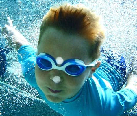 One of our fearless four year old swimmers showing off!