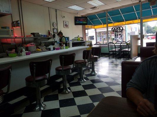 Small town diner with booths and counter seating.