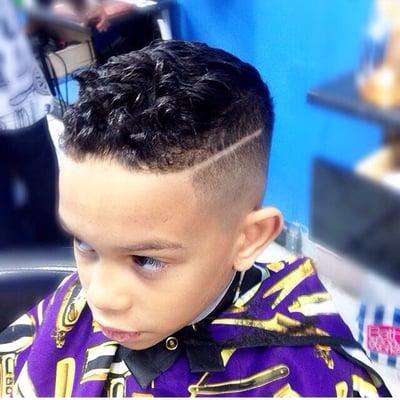 Kids skin fade with part. Text for appointment 718-413-3277