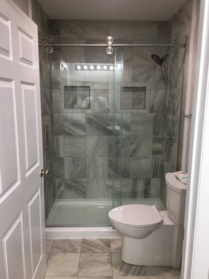 Complete bathroom remodel with tile walk in shower.