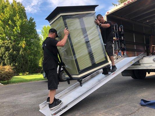 Damien and Austin Team up to lift this armoire.