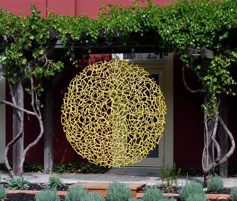 Colorful abstract sculpture along Arnold Drive, in front of the businesses of Jack London Village.