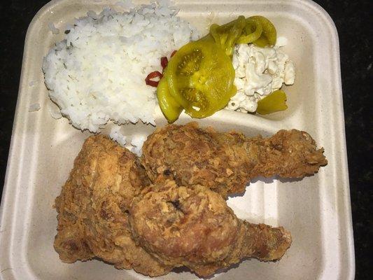 Fried chicken plate with rice, salmon mac salad and pickled tomatoes.