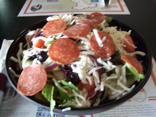 Italian Lettuce Salad with all the pizza toppings and your choice of dressing, $7.95.