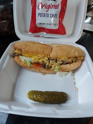 Steak Supreme Sub with chips and pickle