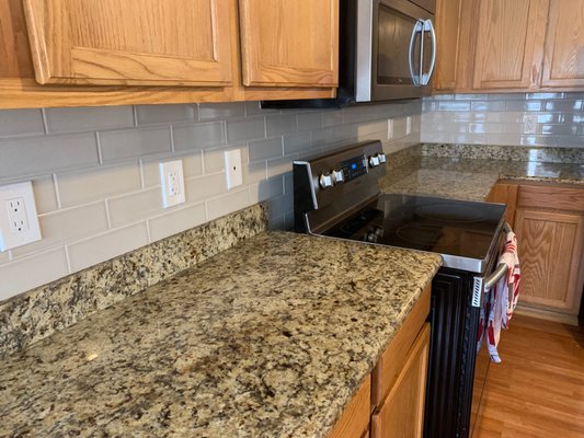 Tile backsplash installation.