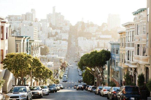 San Francisco City Street with Road, Cars, and Cityscape in Background