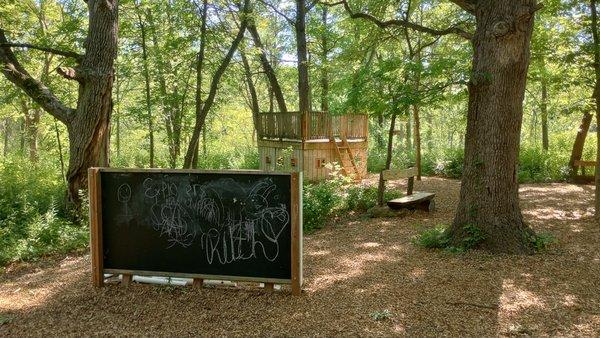 Chalkboard & Platform Shelter in "Wander Woods Nature Play Space"