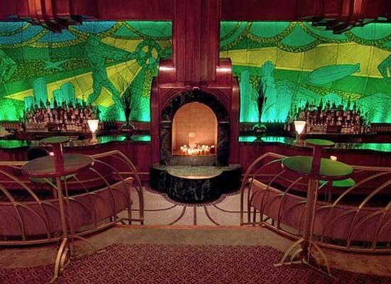 Art-deco inspired Emerald mural behind the bar.