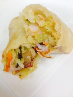 Spring Roll. Fresh shrimp and marinated pork with seasoned vegetables wrapped in a paper thin crispy shell.