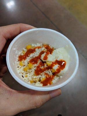 Sample fresh corn with cheese, mayo, and cayenne pepper.