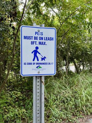 Not to-scale sign for pets or leash