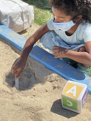 Writing in the sand.